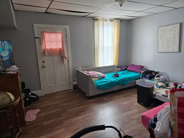 a room with furniture and wooden floor