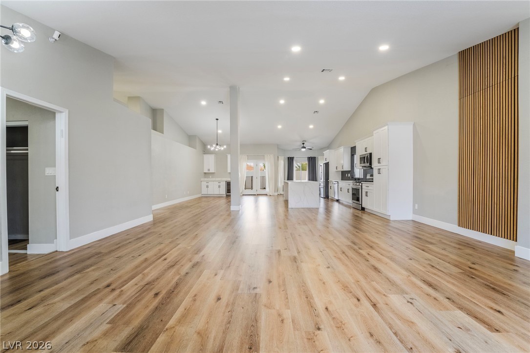 9171 West Viking Road Las Vegas, NV 89147 - Photo 43 of 43 An open floorplan features recessed lighting and durable wood flooring.