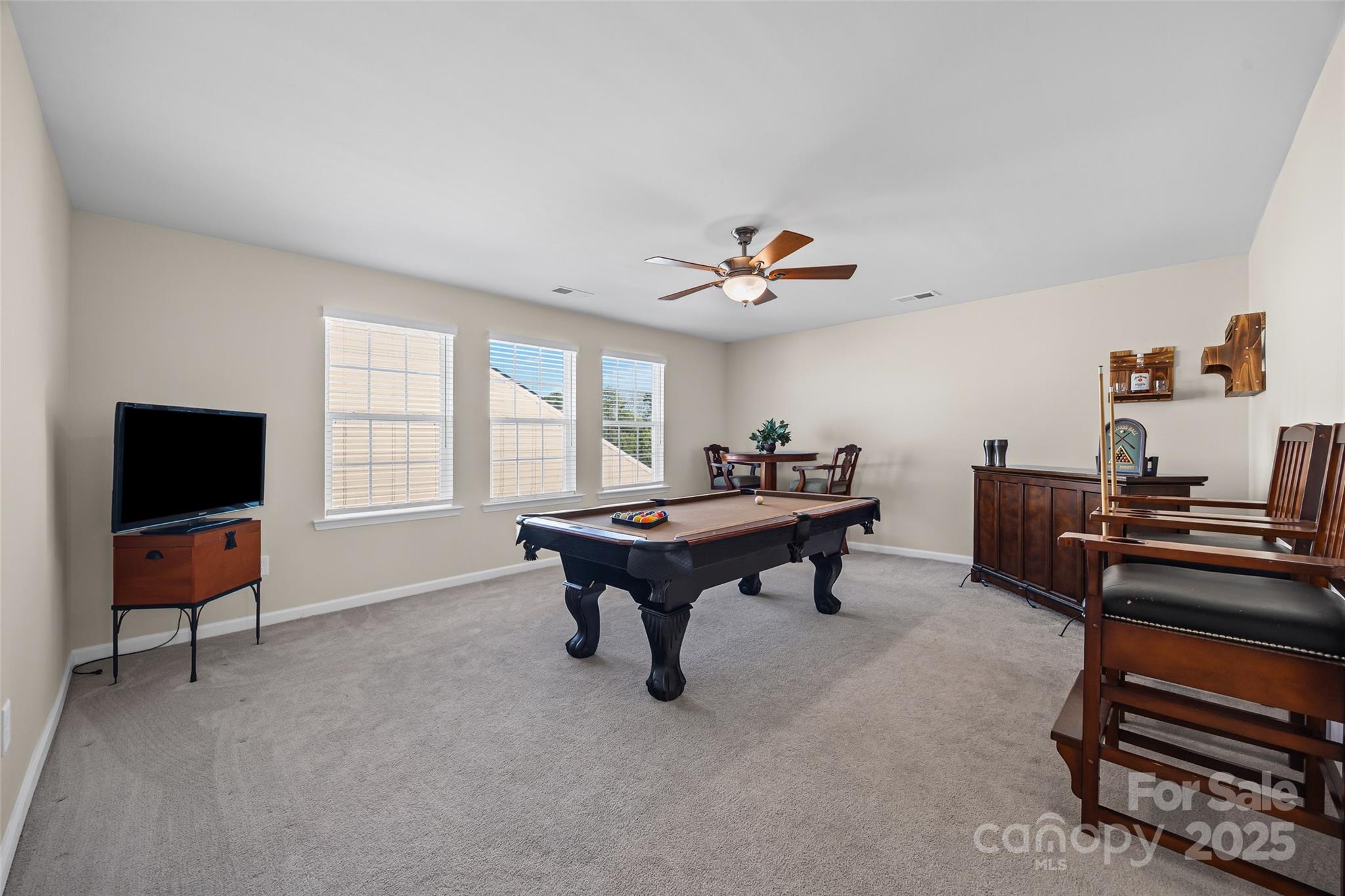 1609 Tranquility Boulevard Lancaster, SC 29720 - Photo 17 of 29 a living room with furniture and a flat screen tv