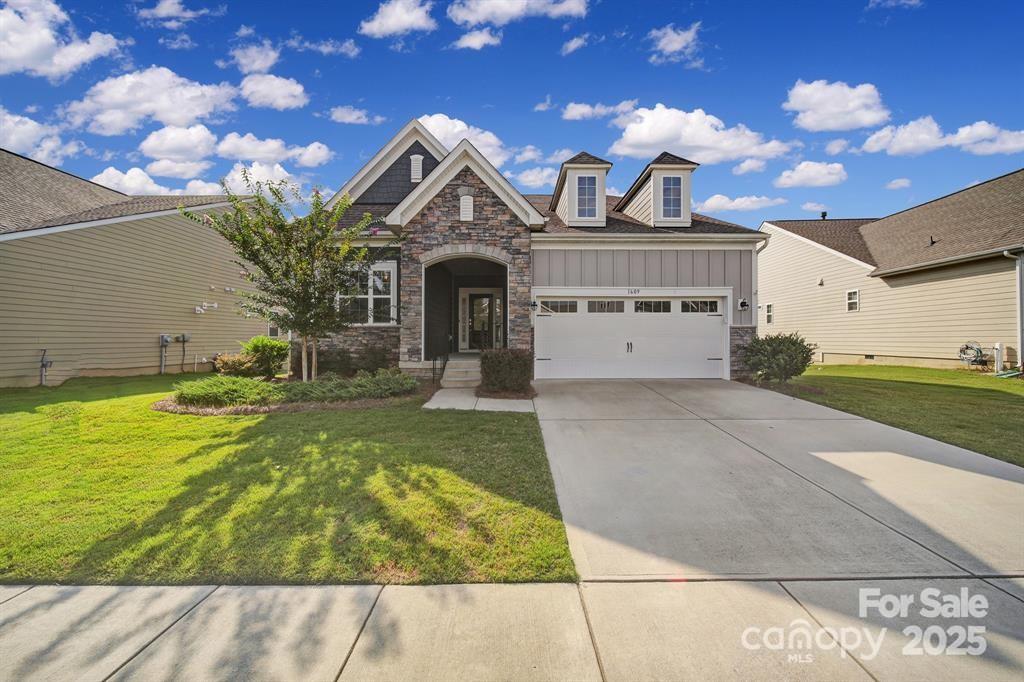 1609 Tranquility Boulevard Lancaster, SC 29720 - Photo 22 of 29 a front view of a house with garden