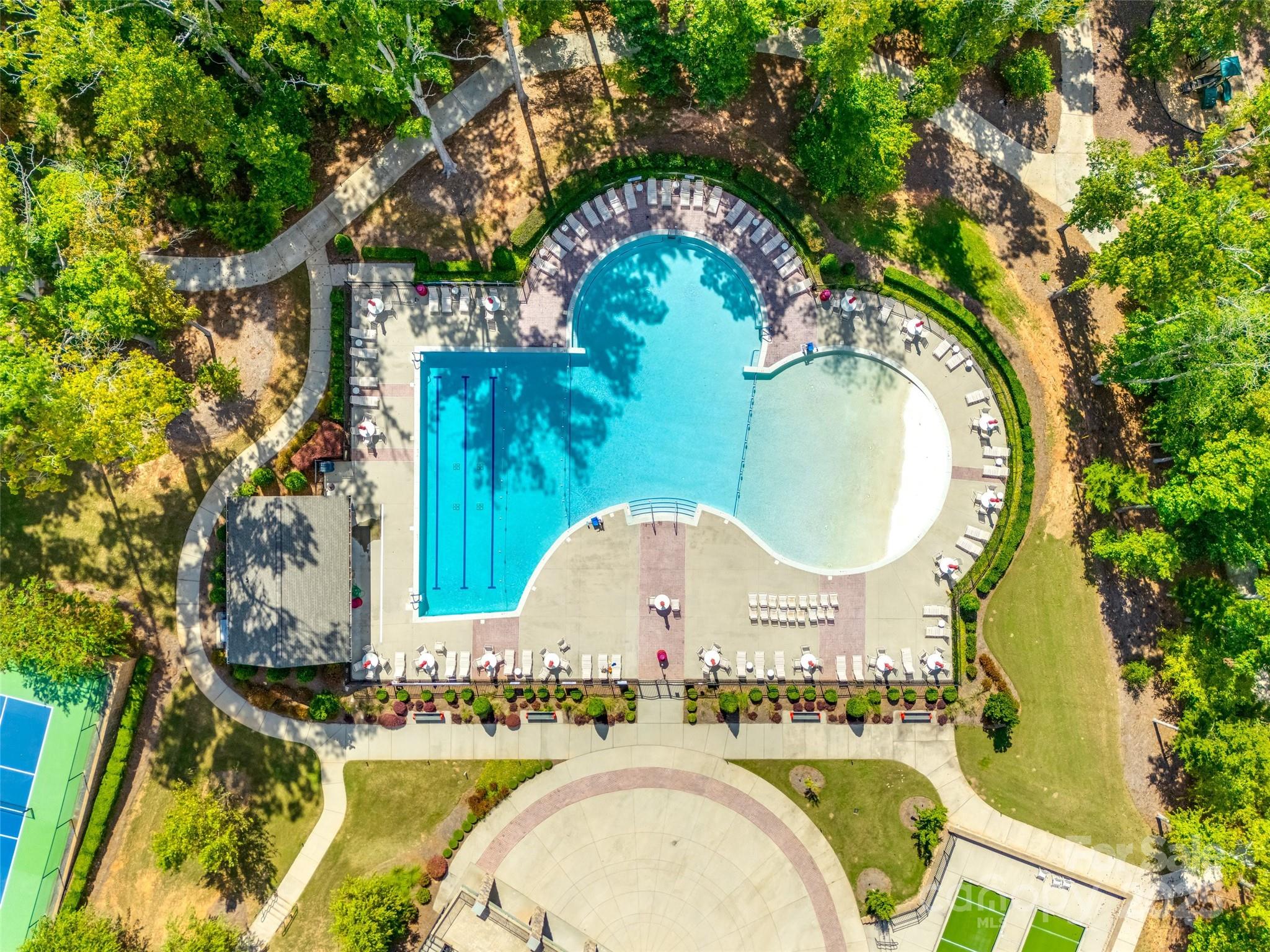 1609 Tranquility Boulevard Lancaster, SC 29720 - Photo 24 of 29 an aerial view of a swimming pool with outdoor seating and yard