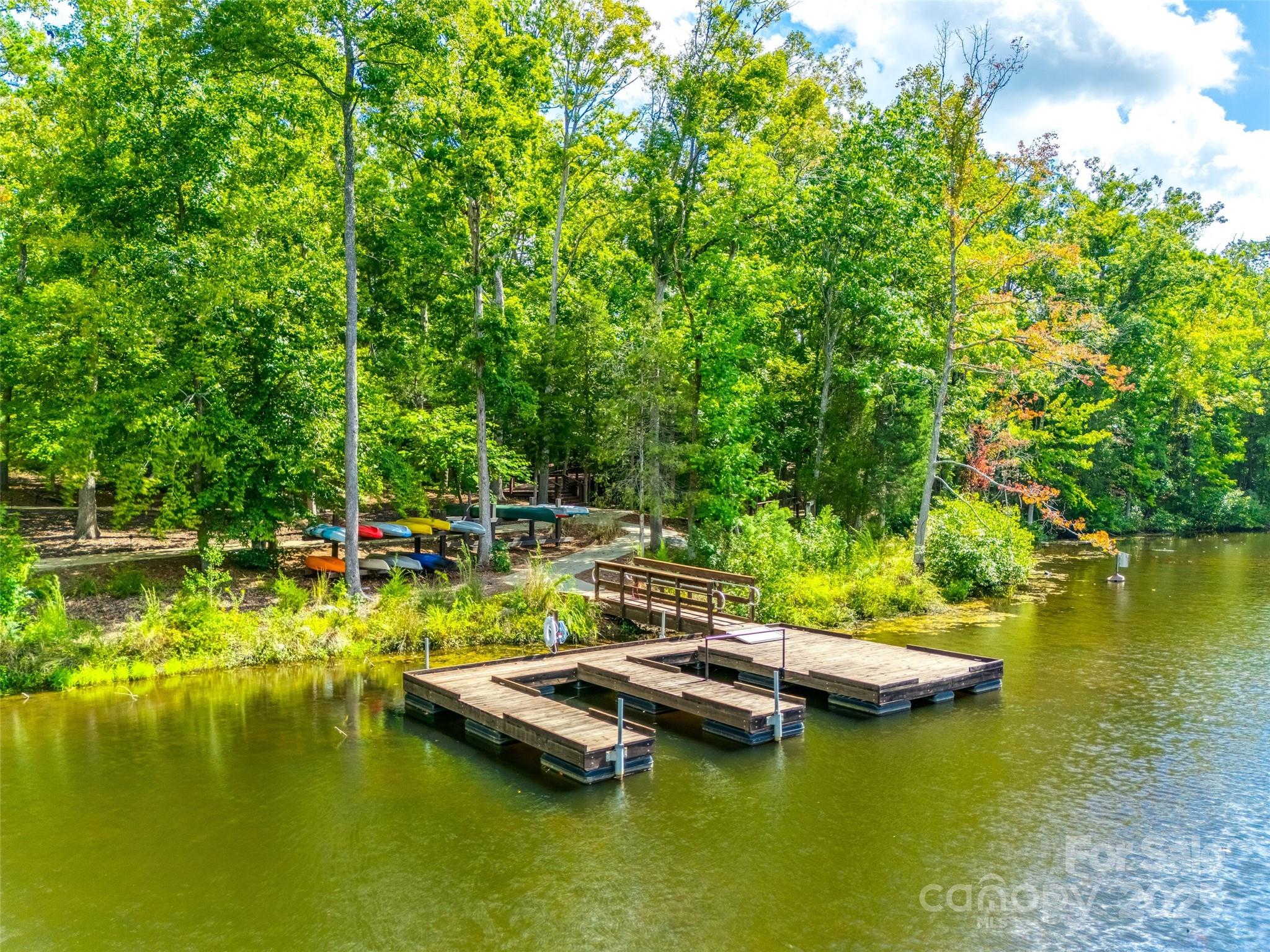 1609 Tranquility Boulevard Lancaster, SC 29720 - Photo 27 of 29 a view of a lake with lawn chairs