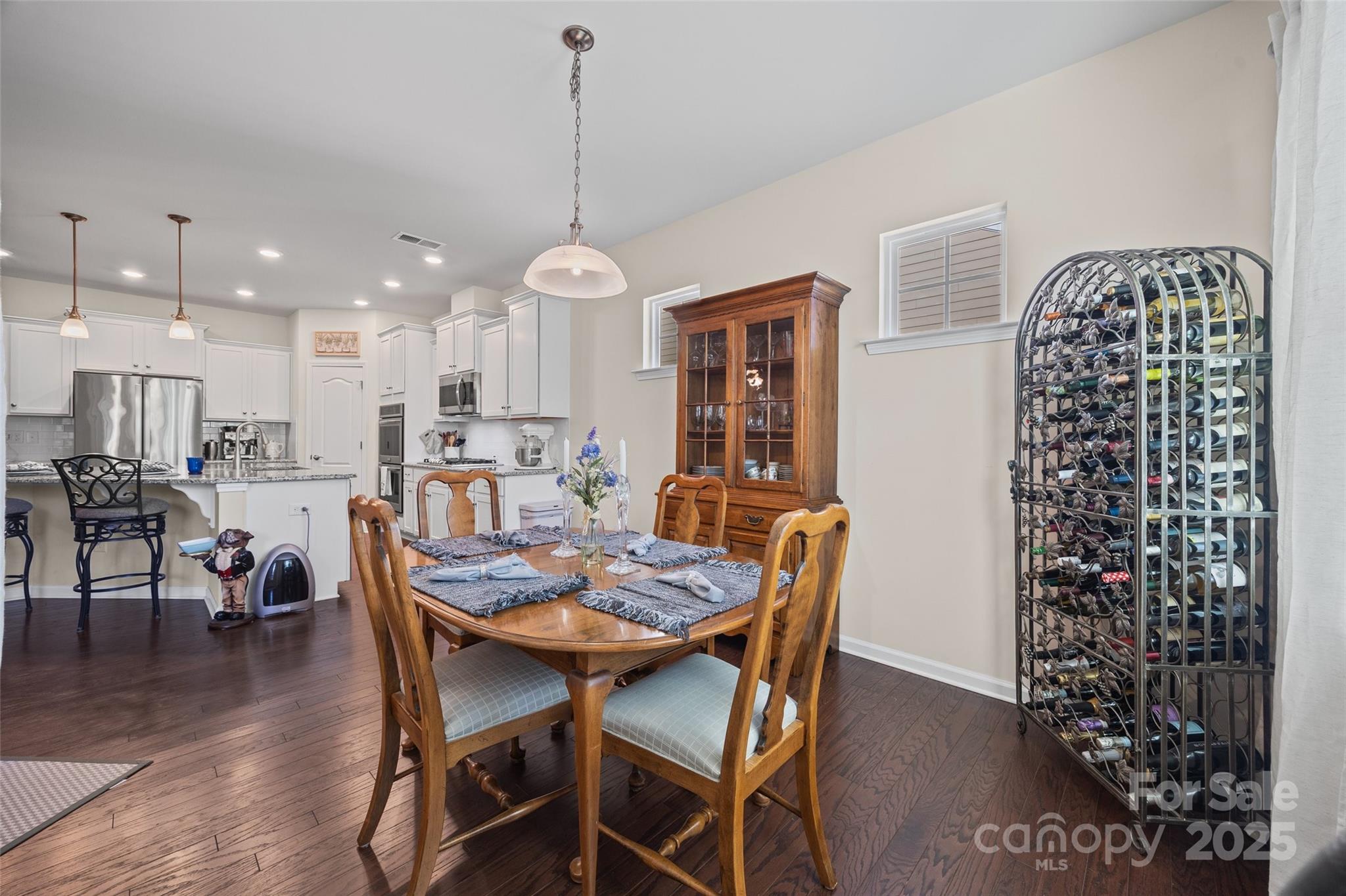 1609 Tranquility Boulevard Lancaster, SC 29720 - Photo 5 of 29 a dining room with furniture a chandelier and wooden floor