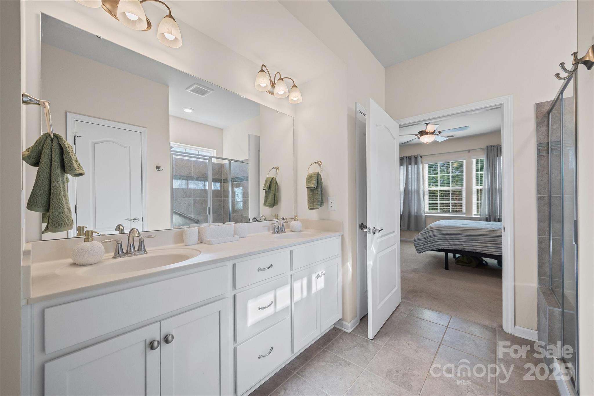 1609 Tranquility Boulevard Lancaster, SC 29720 - Photo 9 of 29 a en suite bathroom with double sink and a large mirror