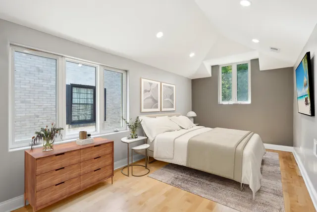 a bathroom with a granite countertop sink a mirror and a shower