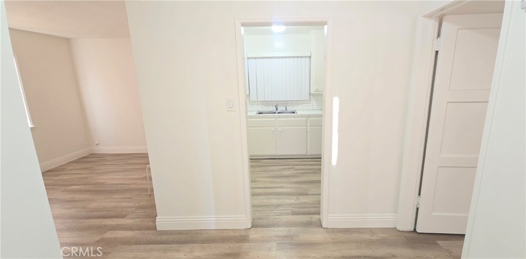 6702 Flora Avenue, Unit A Bell, CA 90201 - Photo 12 of 17 Dining area with view of living room on the left and the kitchen in the front