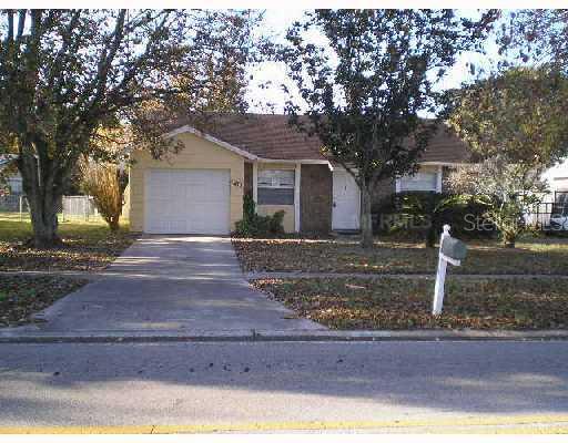 7762 Mitchell Ranch Road New Port Richey, FL 34655 - Photo 1 of 1 a front view of a house with yard