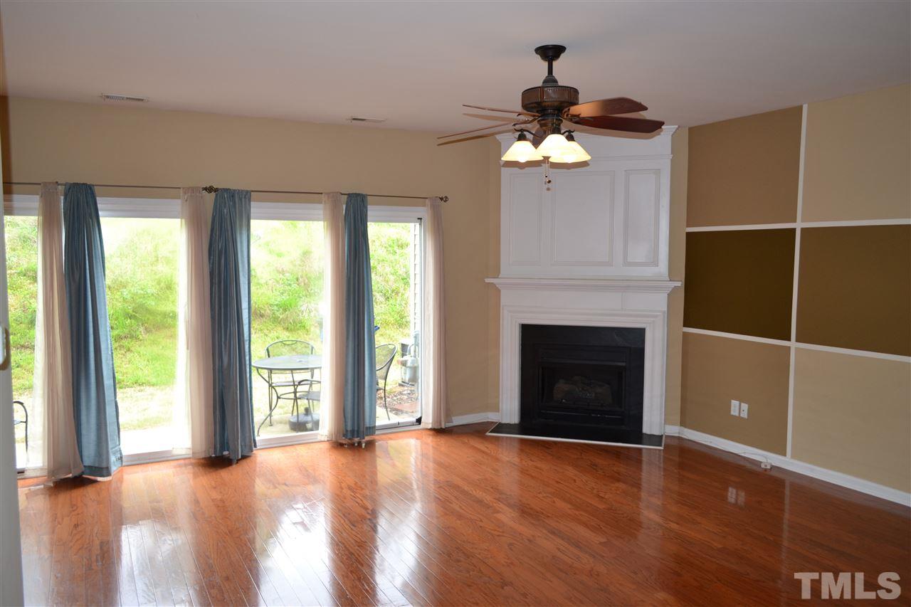 5125 Echo Ridge Road Raleigh, NC 27612 - Photo 2 of 13 a view of an empty room with a window and fireplace
