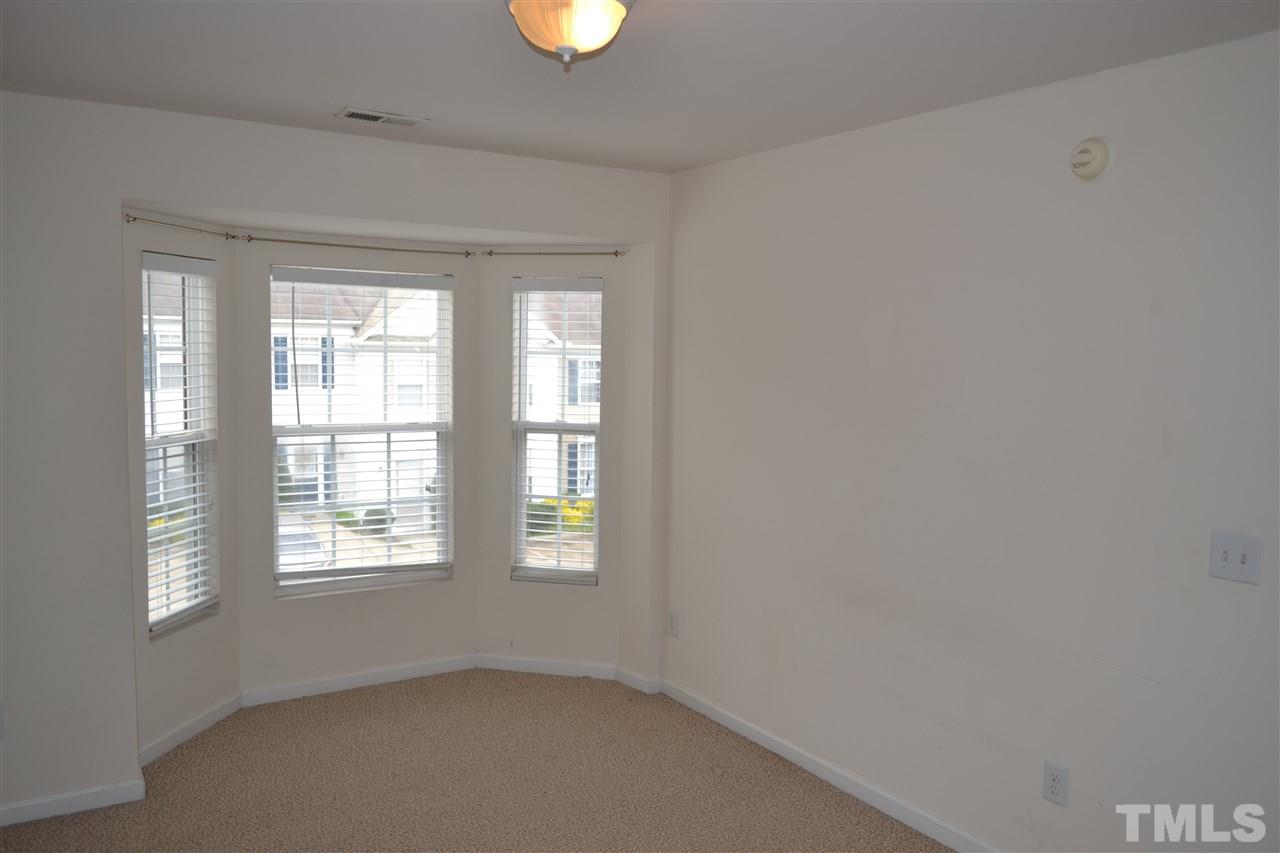 5125 Echo Ridge Road Raleigh, NC 27612 - Photo 11 of 13 an empty room with windows