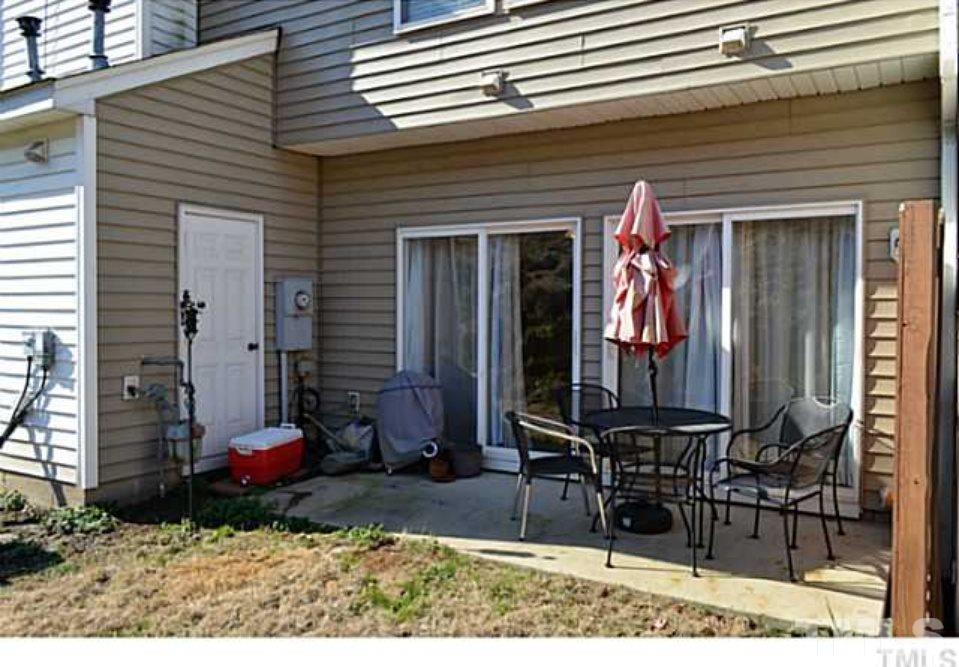5125 Echo Ridge Road Raleigh, NC 27612 - Photo 12 of 13 a front view of a house with patio