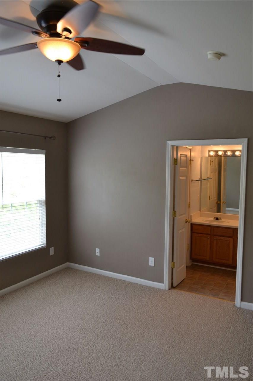 5125 Echo Ridge Road Raleigh, NC 27612 - Photo 6 of 13 a view of an empty room with a window