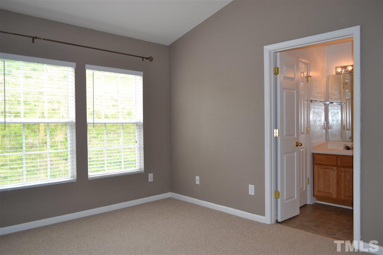 5125 Echo Ridge Road Raleigh, NC 27612 - Photo 7 of 13 a view of an empty room with a window