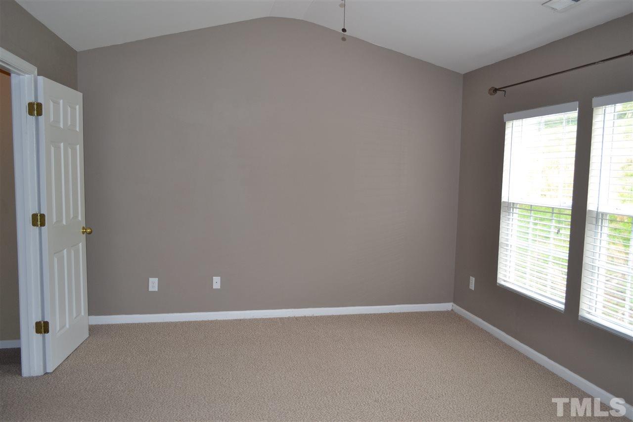 5125 Echo Ridge Road Raleigh, NC 27612 - Photo 8 of 13 a view of an empty room with a window