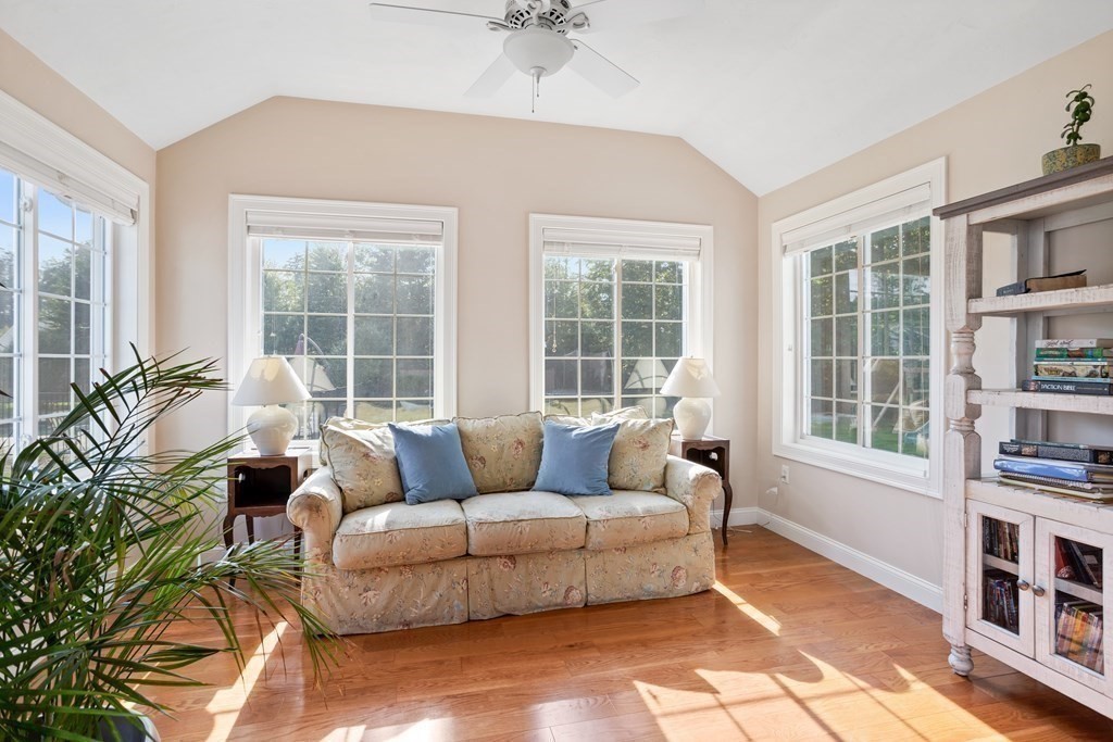 145 Old Farm Way Ayer, MA 01432 - Photo 19 of 39 a living room with furniture and a potted plant next to a window