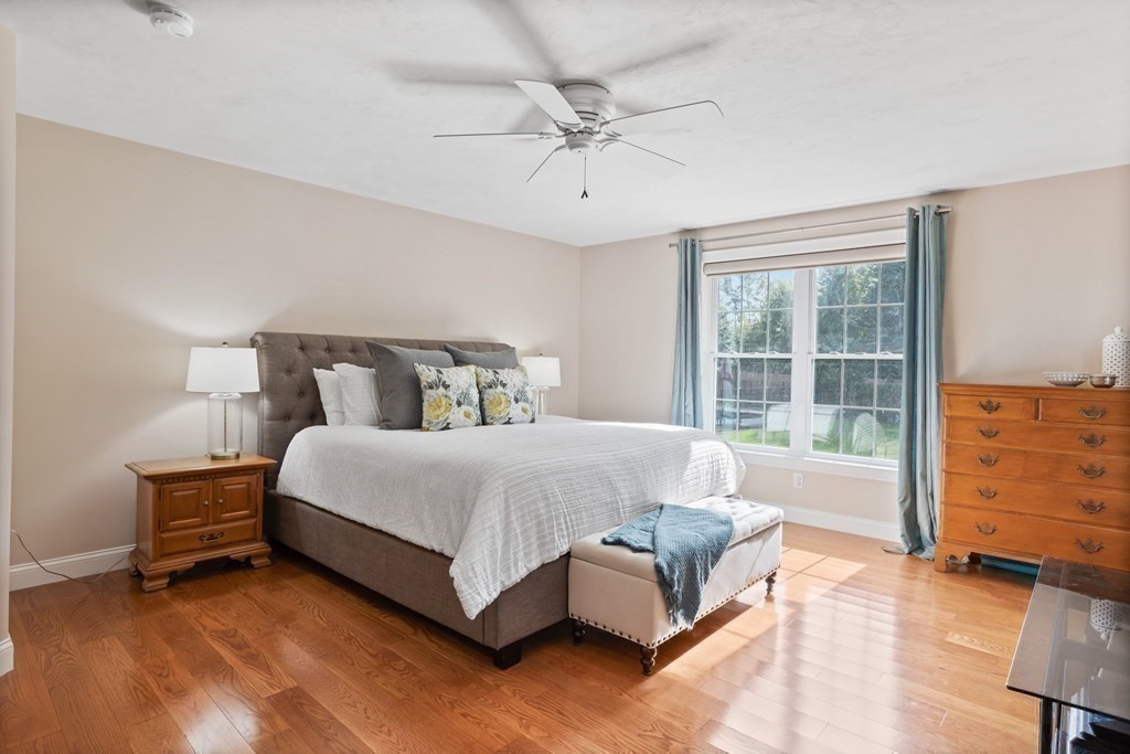 145 Old Farm Way Ayer, MA 01432 - Photo 22 of 39 a spacious bedroom with a bed and a dresser