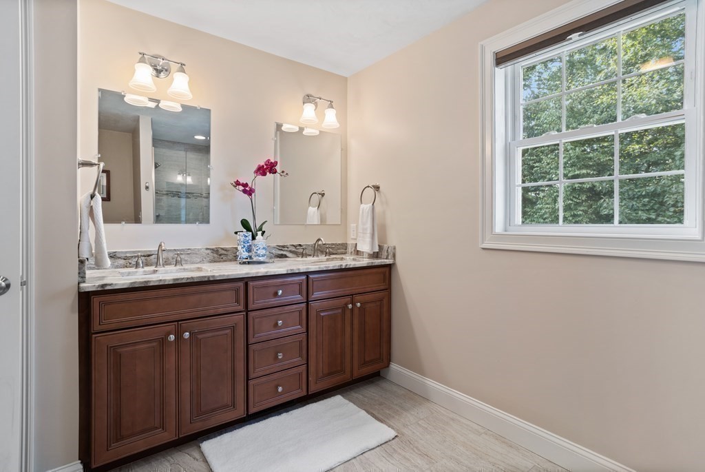 145 Old Farm Way Ayer, MA 01432 - Photo 24 of 39 a bathroom with a granite countertop double vanity sink and a mirror