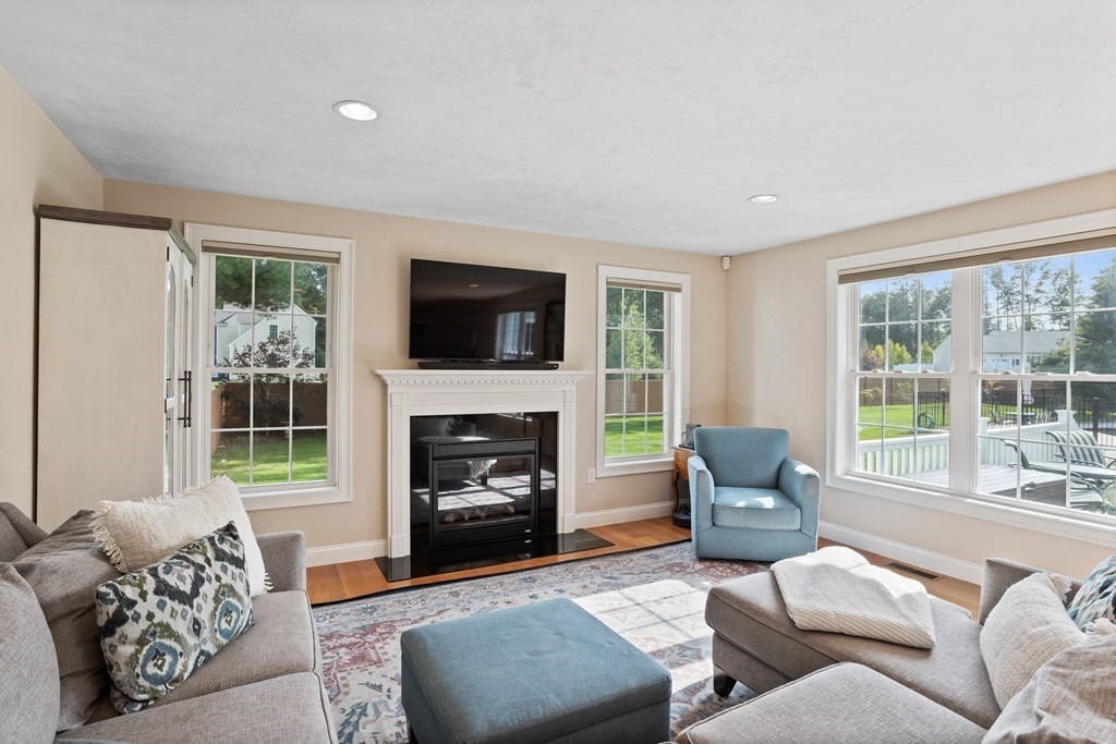 145 Old Farm Way Ayer, MA 01432 - Photo 8 of 39 a living room with furniture and a fireplace