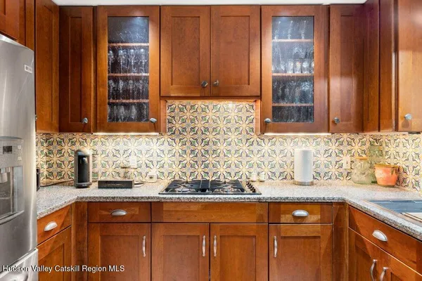 a view of a brick house with many windows