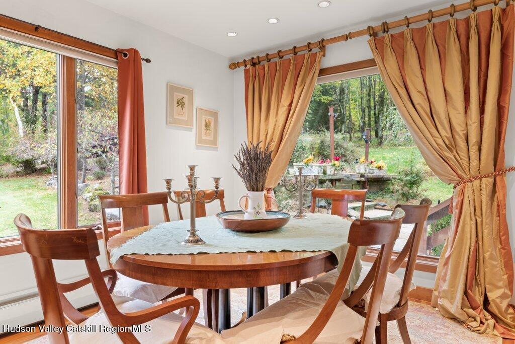 388 Sky Farm Road, Unit STOP 11 Copake, NY 12516 - Photo 15 of 57 a view of a dining room with furniture window and outside view