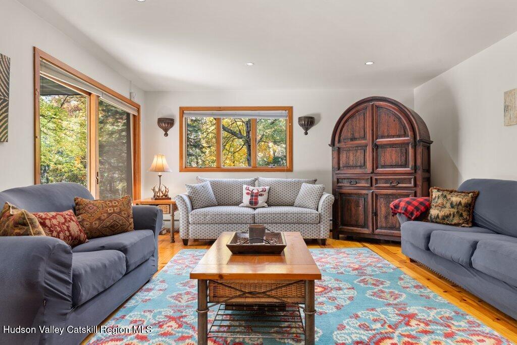388 Sky Farm Road, Unit STOP 11 Copake, NY 12516 - Photo 24 of 57 a living room with furniture and a large window