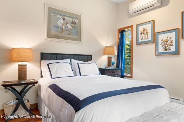 a bedroom with a bed and a fireplace