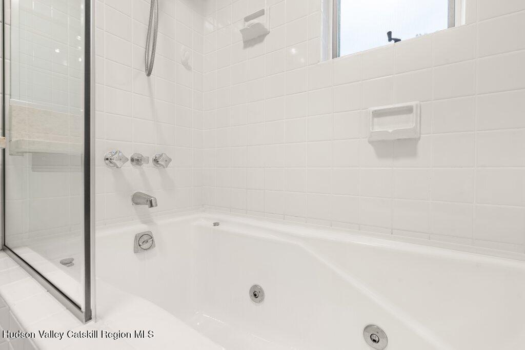 388 Sky Farm Road, Unit STOP 11 Copake, NY 12516 - Photo 33 of 57 a bathroom with a bathtub