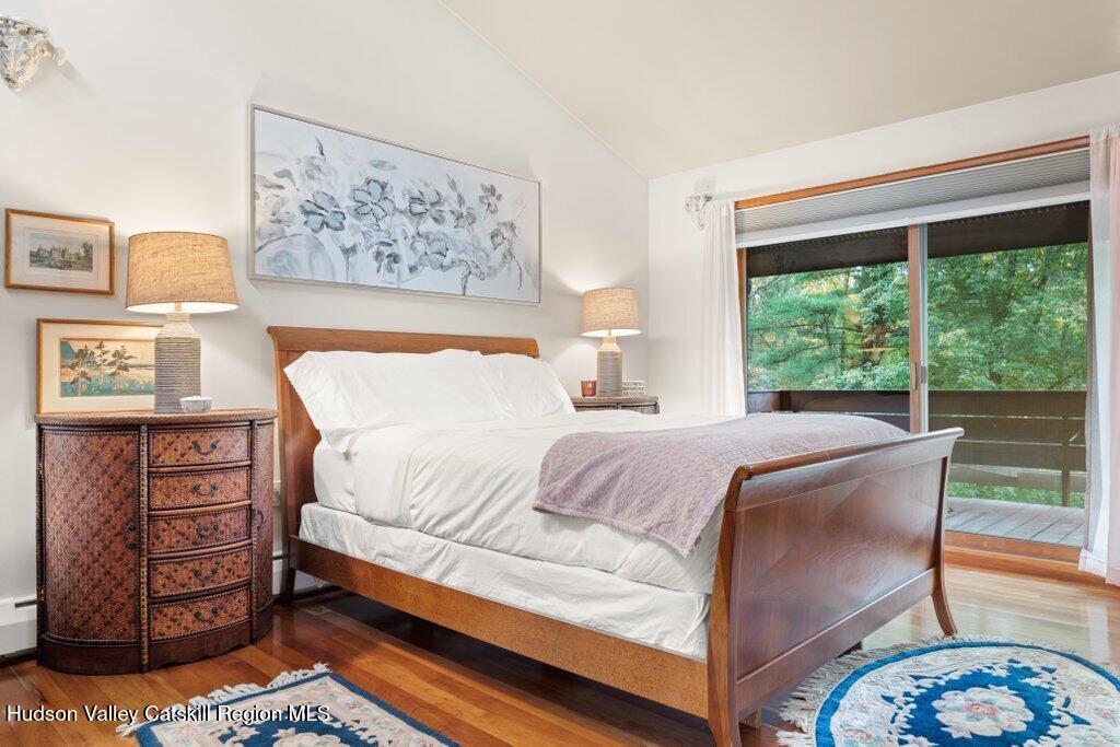 388 Sky Farm Road, Unit STOP 11 Copake, NY 12516 - Photo 38 of 57 a bedroom with a bed and a dresser next to a window