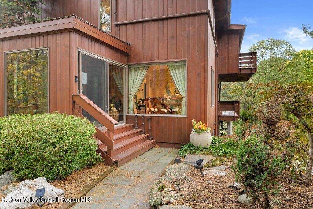 388 Sky Farm Road, Unit STOP 11 Copake, NY 12516 - Photo 48 of 57 a front view of a house with a garden