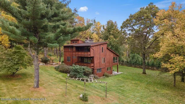 a bathroom with a sink a mirror and shower