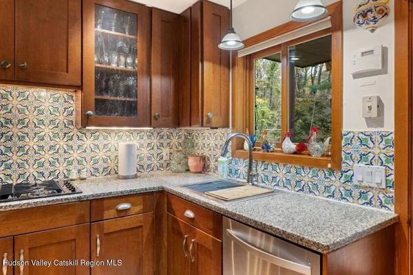 a kitchen with a sink and cabinets