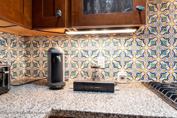 a kitchen with a sink and a stove