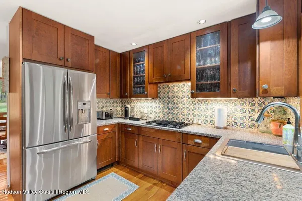 a kitchen with a granite countertop sink and a granite counter top
