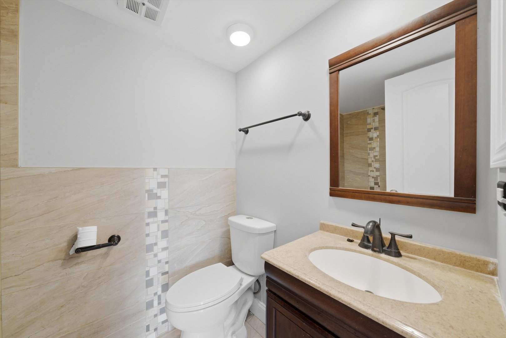18205 Hart Drive, Unit 3A Homewood, IL 60430 - Photo 13 of 27 a bathroom with a sink toilet vanity and shower
