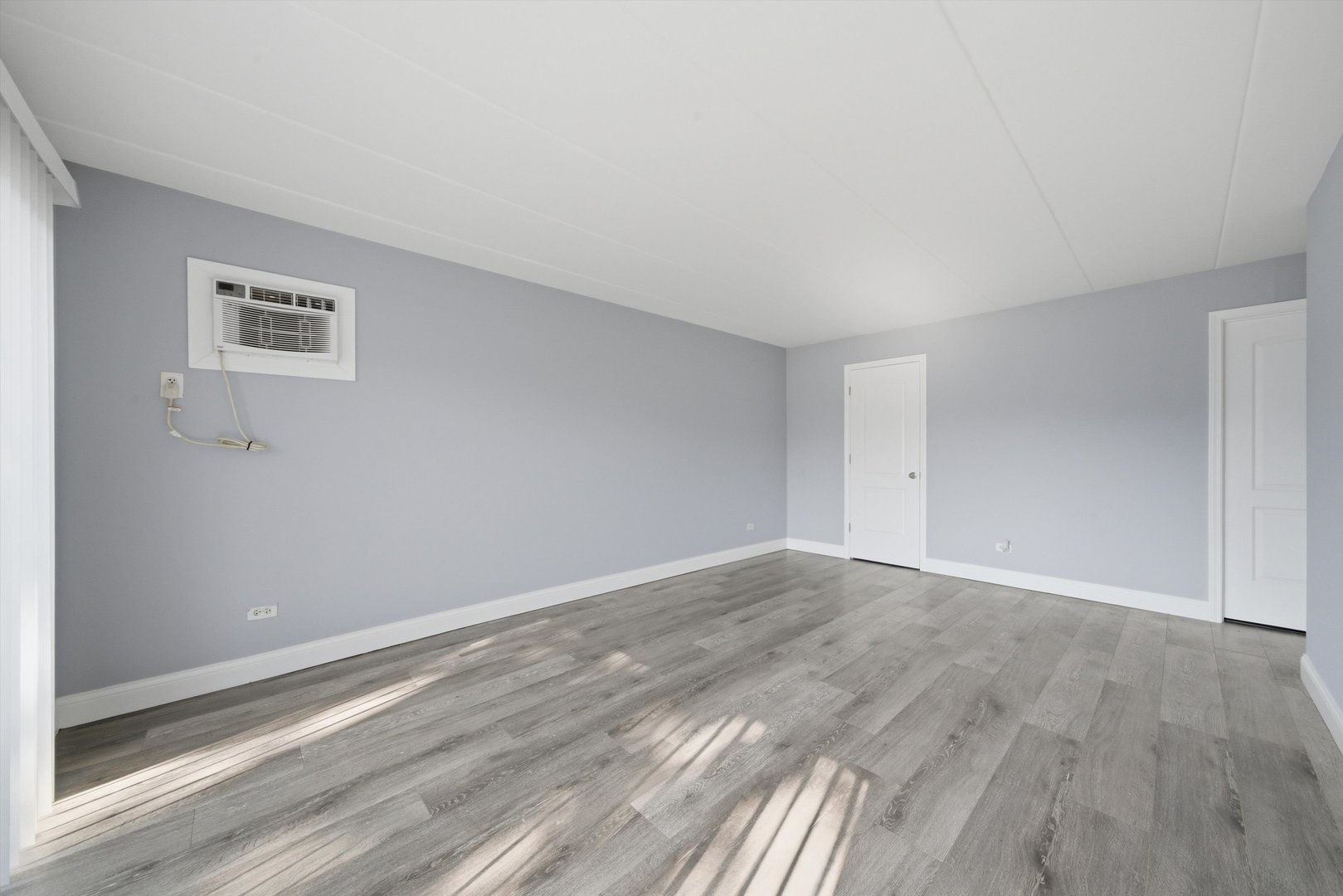 18205 Hart Drive, Unit 3A Homewood, IL 60430 - Photo 15 of 27 a view of an empty room with wooden floor