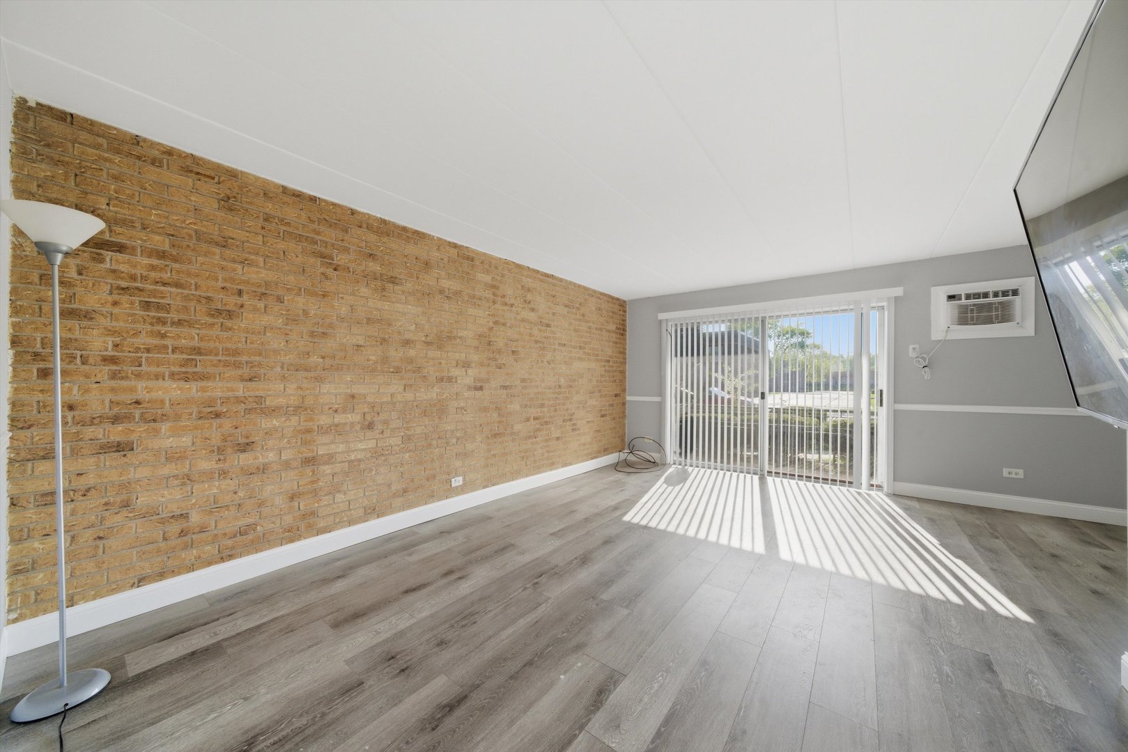 18205 Hart Drive, Unit 3A Homewood, IL 60430 - Photo 5 of 27 a view of wooden floor in an empty room with a window