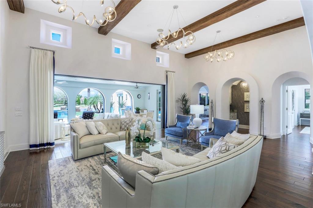 16683 Lucarno Way Naples, FL 34110 - Photo 13 of 35 a living room with furniture and a large window