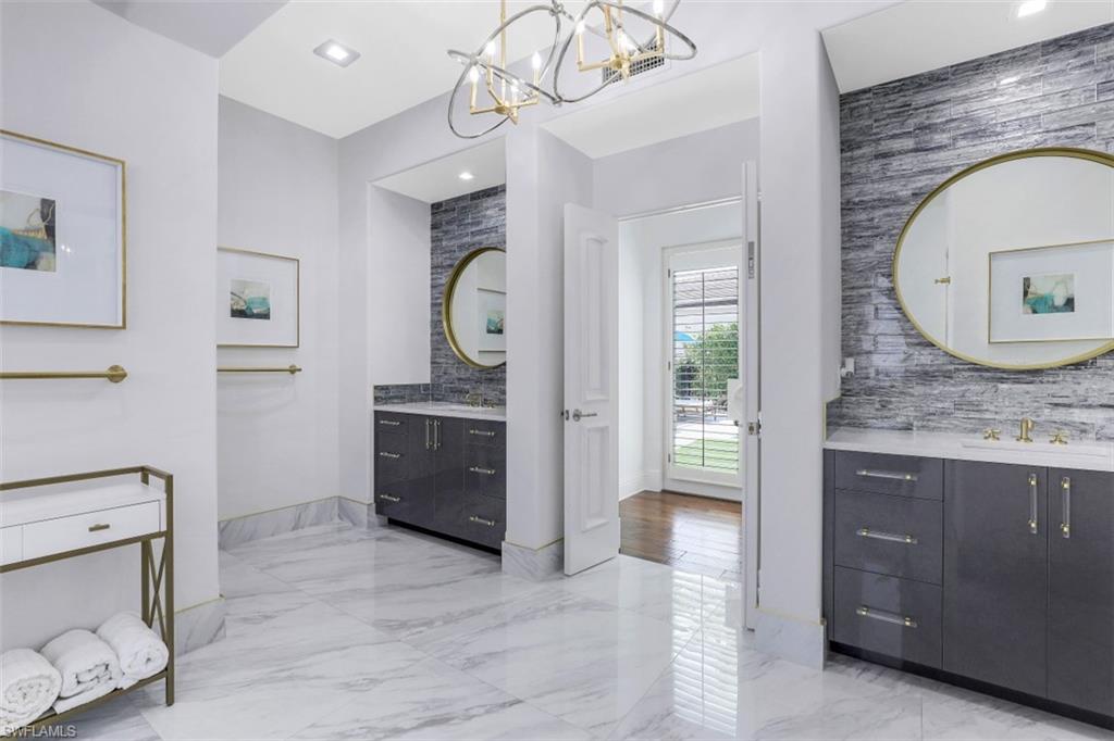 16683 Lucarno Way Naples, FL 34110 - Photo 18 of 35 a view of hallway with washer and dryer