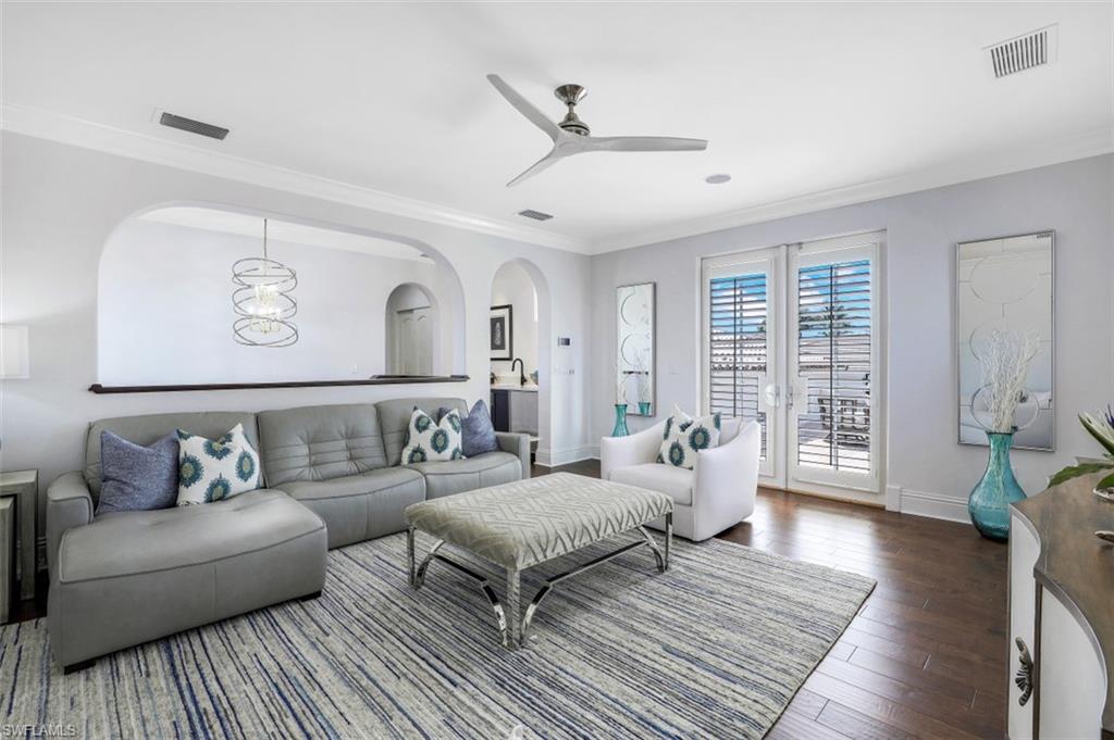 16683 Lucarno Way Naples, FL 34110 - Photo 20 of 35 a living room with furniture and wooden floor