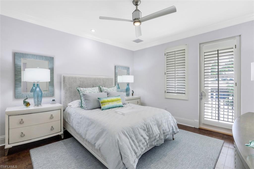 16683 Lucarno Way Naples, FL 34110 - Photo 22 of 35 a bedroom with a bed and a window