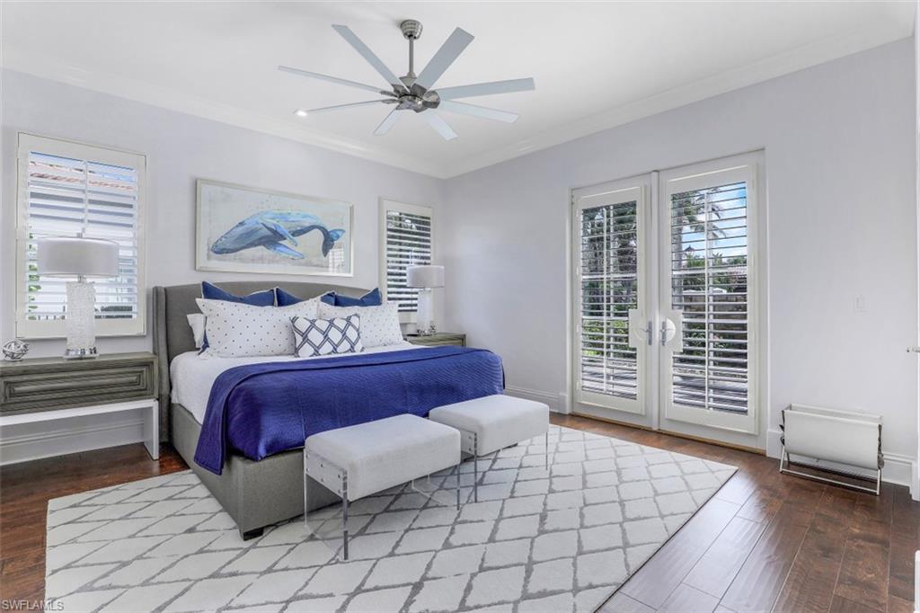 16683 Lucarno Way Naples, FL 34110 - Photo 25 of 35 a bedroom with a large bed and a window