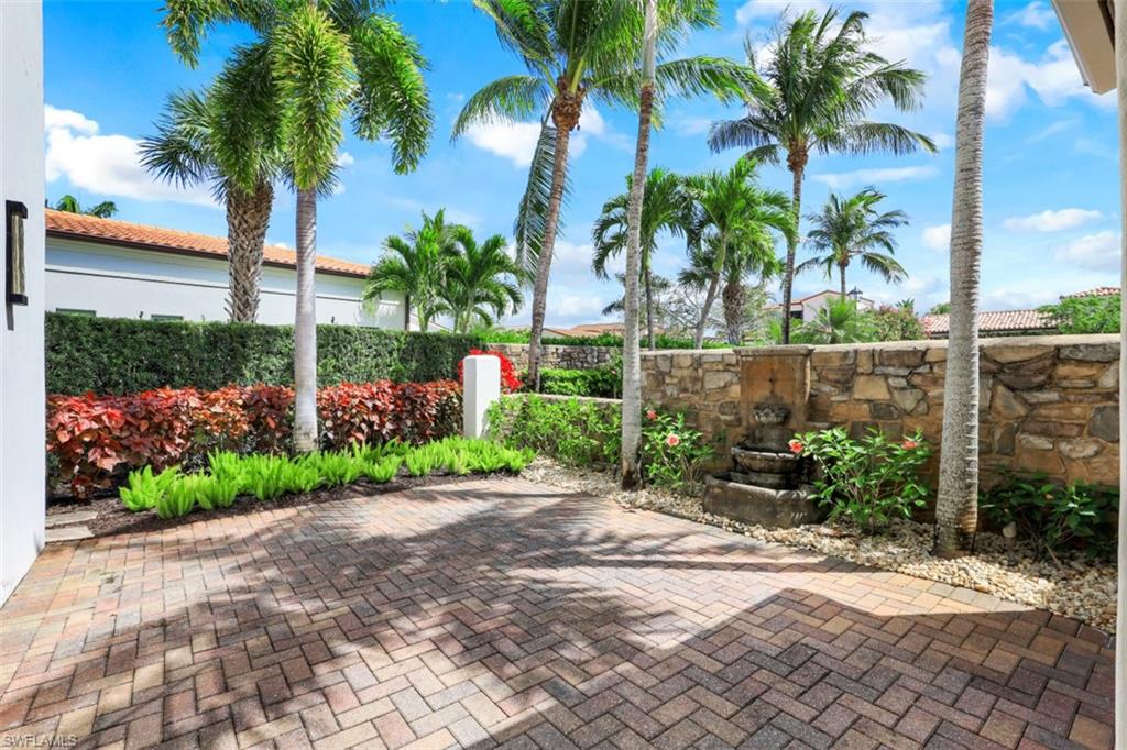 16683 Lucarno Way Naples, FL 34110 - Photo 26 of 35 a view of a garden with a palm tree