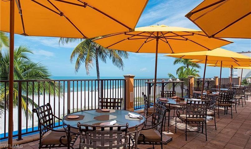 16683 Lucarno Way Naples, FL 34110 - Photo 34 of 35 a view of a chairs and table in the patio