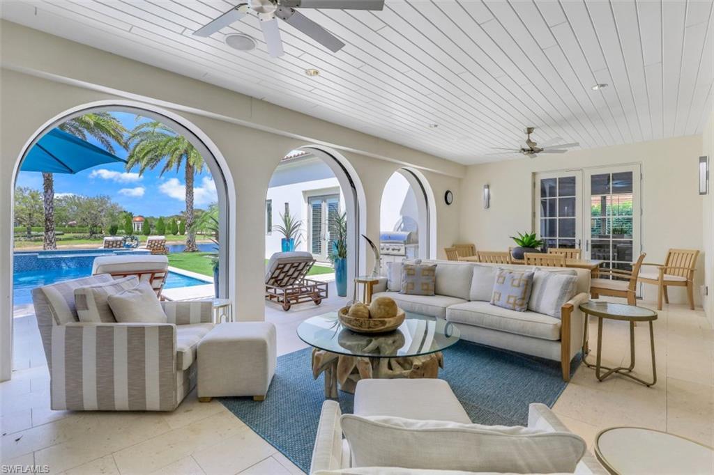 16683 Lucarno Way Naples, FL 34110 - Photo 7 of 35 a living room with patio furniture and a large window