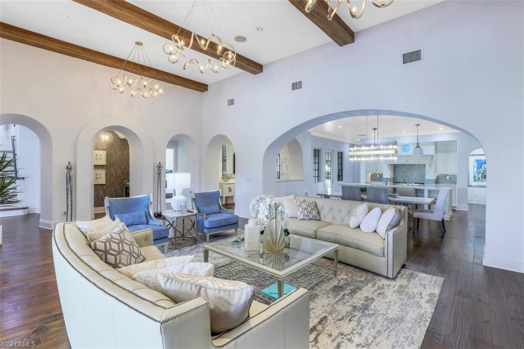 16683 Lucarno Way Naples, FL 34110 - Photo 8 of 35 a living room with fireplace furniture and a large window