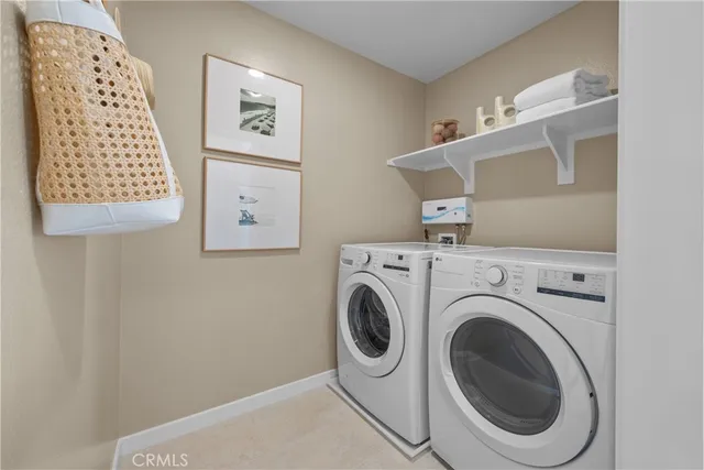 a view of livingroom with washer and dryer