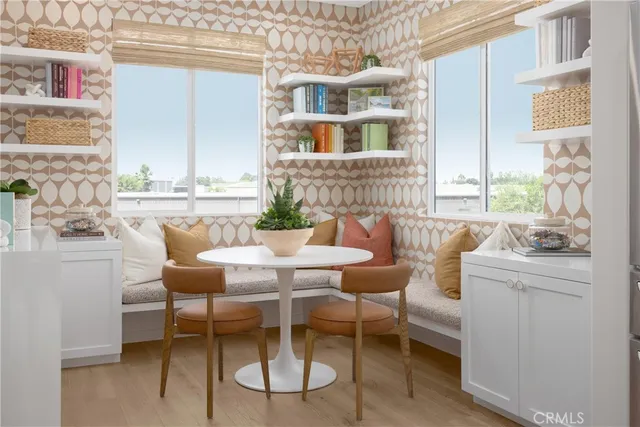 a dining room with furniture and windows