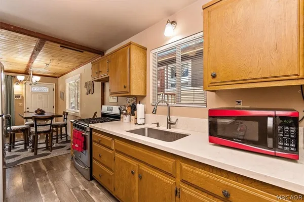 a kitchen with sink and cabinets