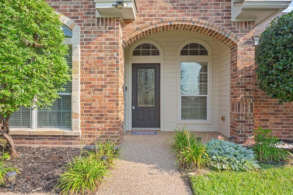 203 Silver Spur Trail Waco, TX 76657 - Photo 2 of 39 View of exterior entry featuring brick siding