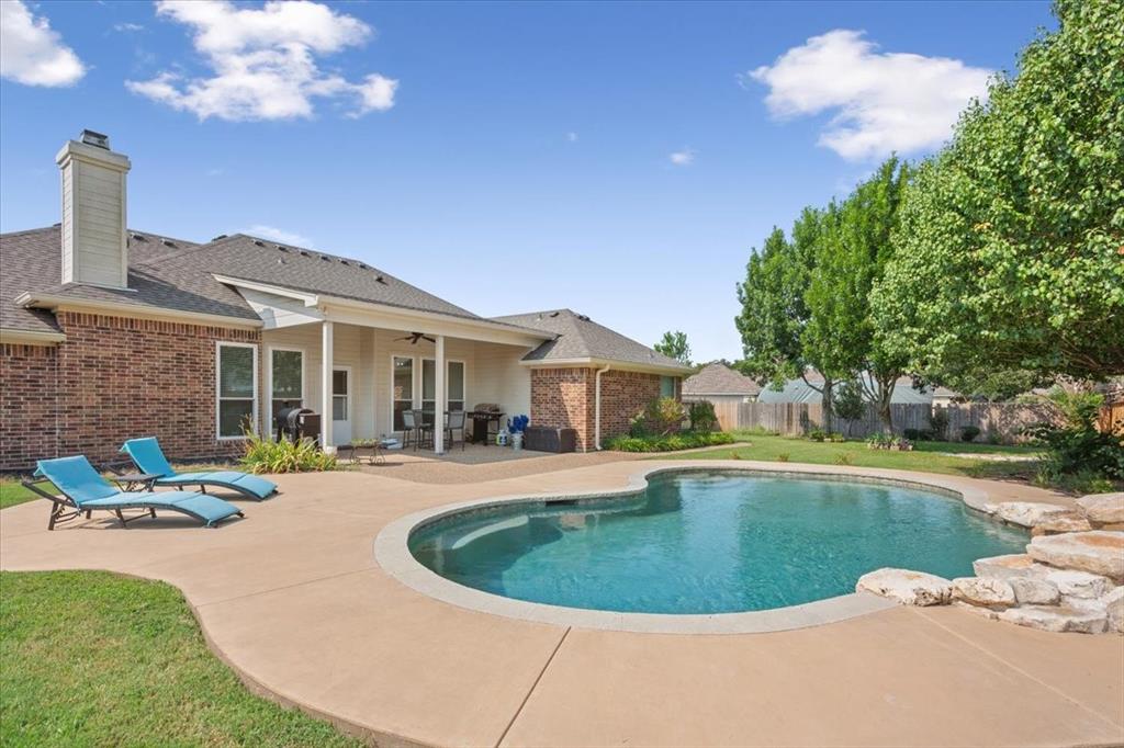 203 Silver Spur Trail Waco, TX 76657 - Photo 32 of 39 View of pool with a patio, ceiling fan, and a fenced backyard