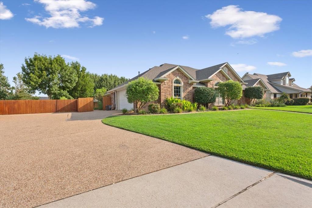 203 Silver Spur Trail Waco, TX 76657 - Photo 36 of 39 Single story home featuring concrete driveway, brick siding, and an attached garage